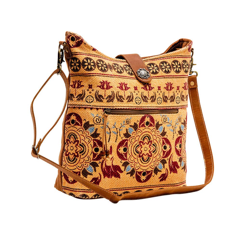 Image of Embroidered handbag with floral patterns on a white background