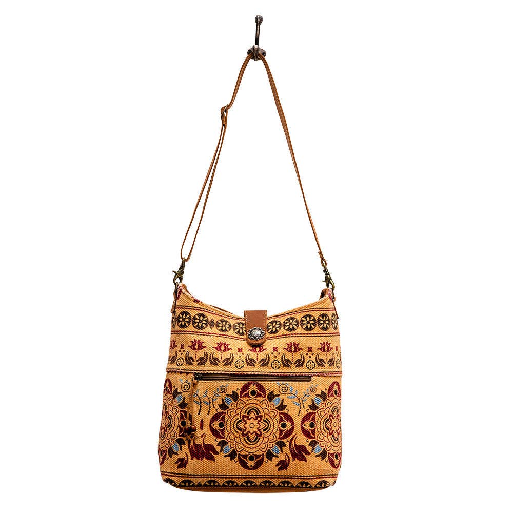 Image of Embroidered handbag with floral patterns on a white background
