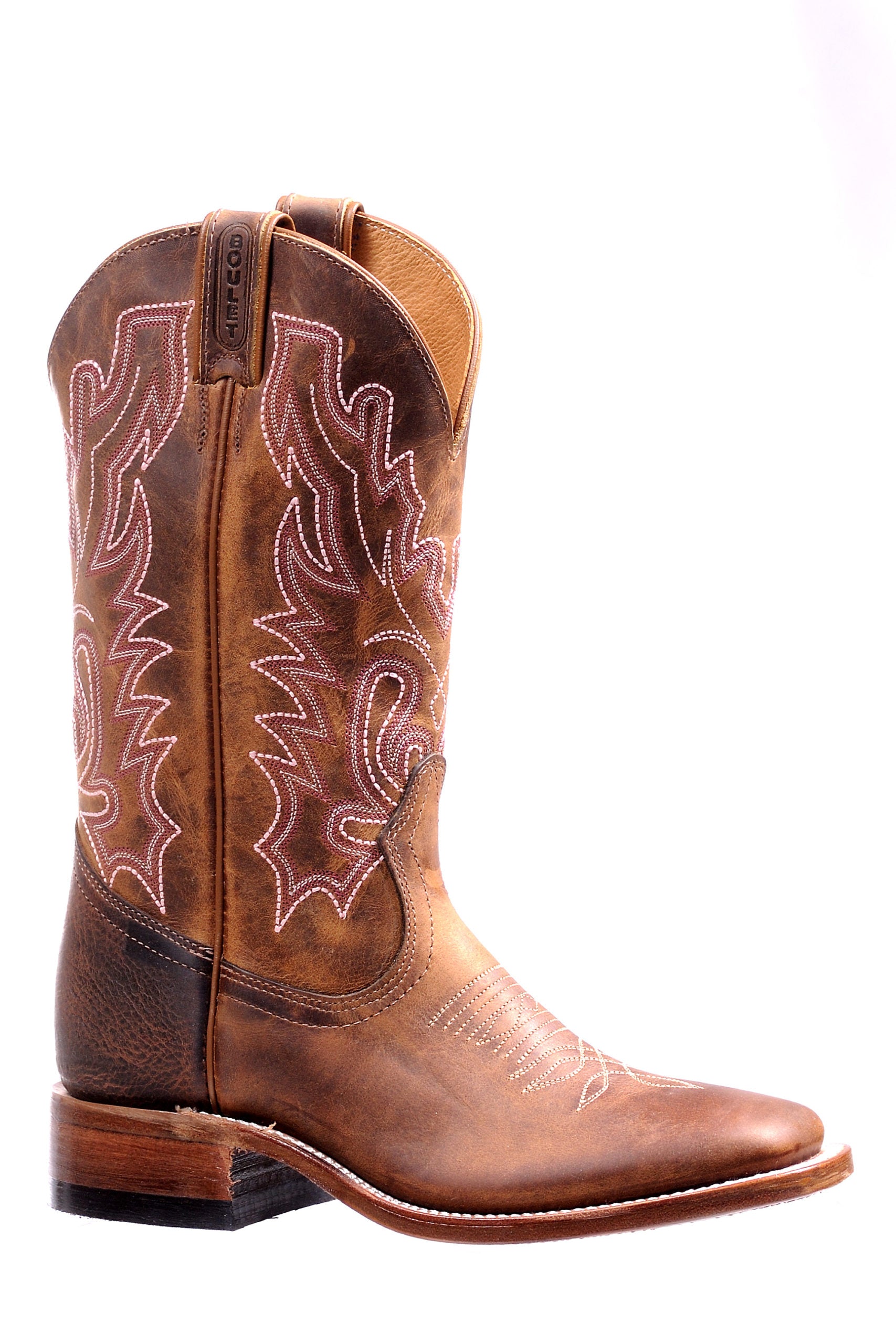 Image of Brown cowboy boot with intricate white stitching on a white background