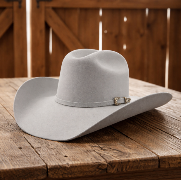 Image of Gray cowboy hat on a wooden surface with a wooden background