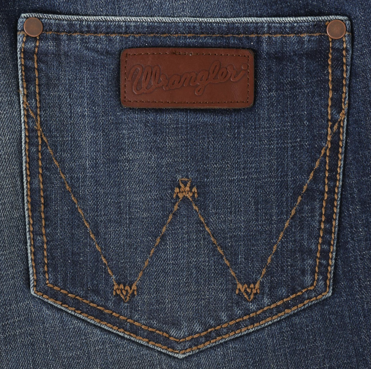 Image of Close-up of a denim pocket with a leather patch and stitching details.