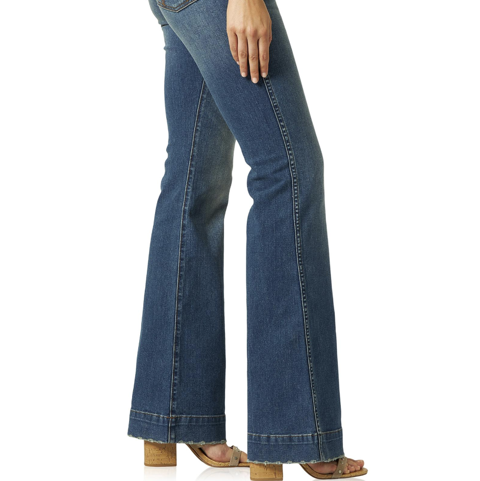 Image of Blue jeans worn by a person on a white background