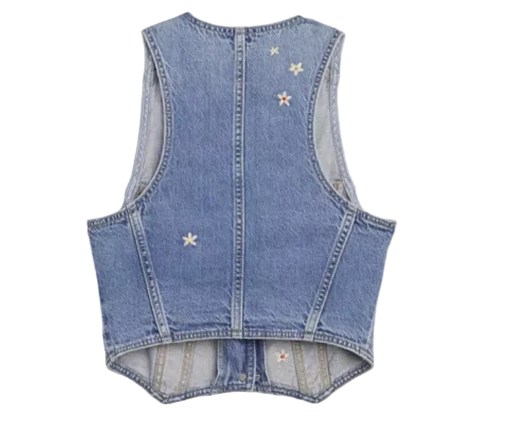 Image of Denim vest with star patterns on a light gray background