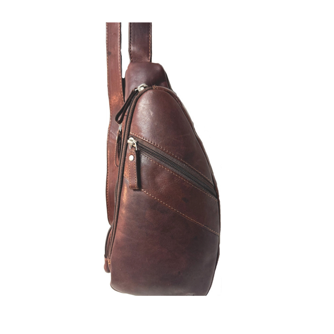Image of Brown leather sling bag on a white background