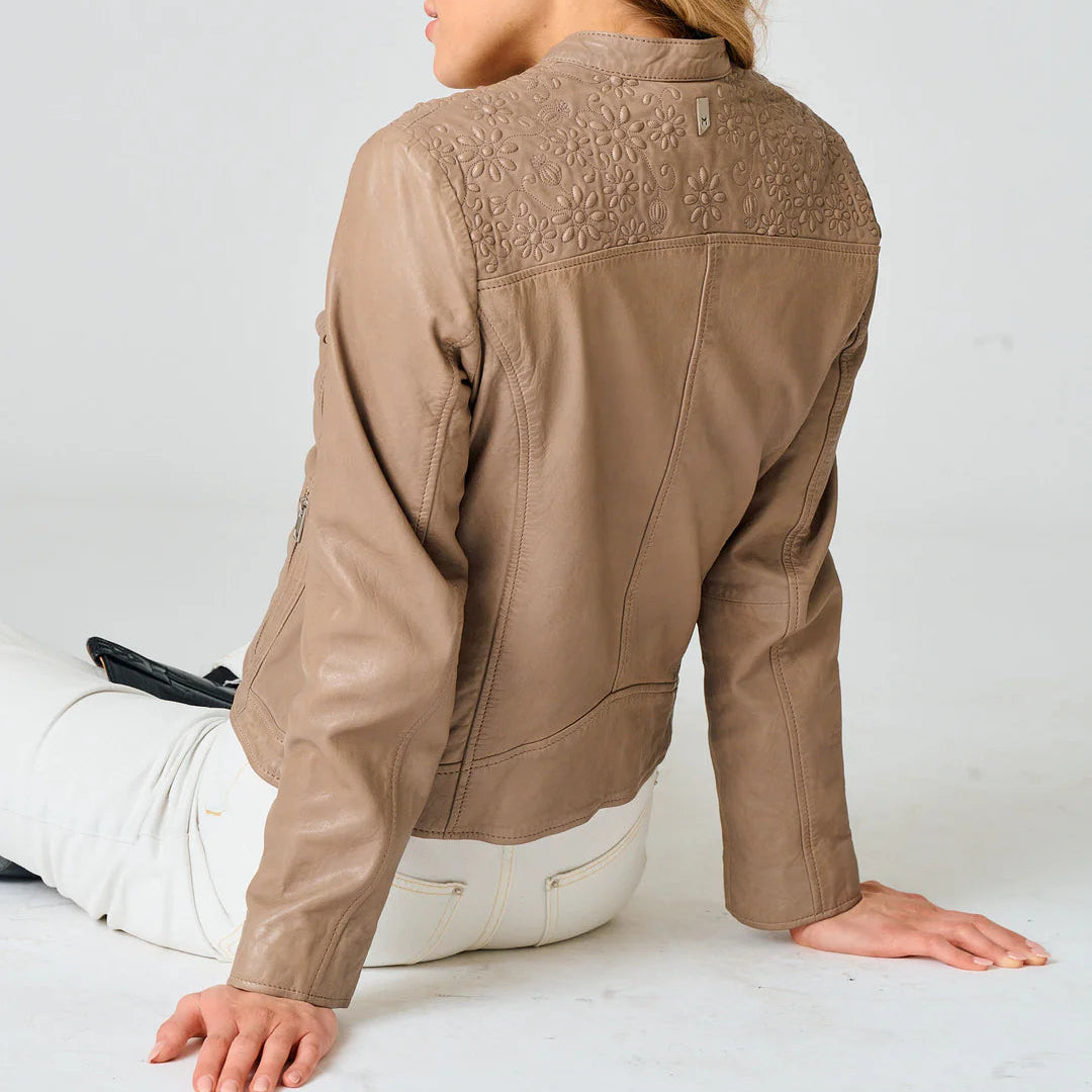 Image of Taupe leather jacket with embossed floral detailing across the back shoulders and a clean, feminine silhouette.