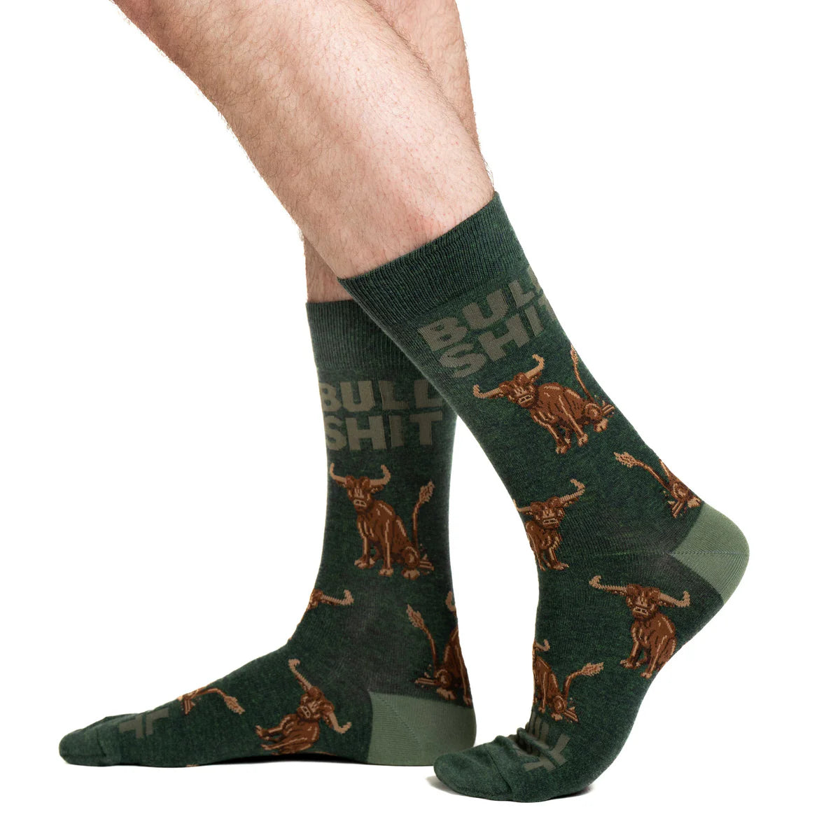 Image of Men’s deep green socks with a bold bull graphic and humorous design, shown worn for a playful statement look.