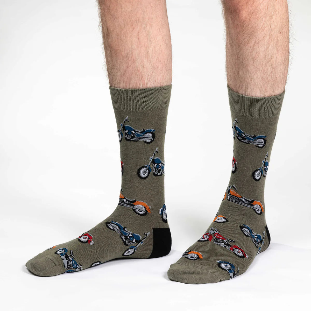 Image of Men’s olive green crew socks with a chopper motorcycle pattern, shown worn for a bold biker inspired look.