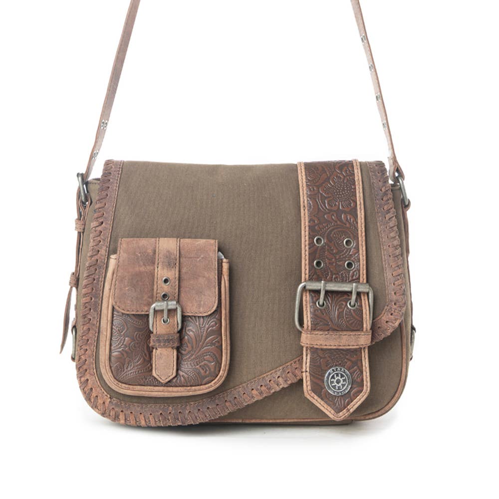 Image of Brown leather and canvas handbag with decorative elements on a white background