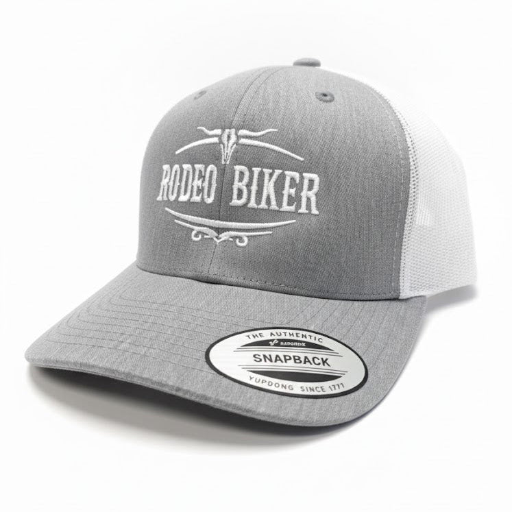 Image of Gray and white cap with 'Rodeo Biker' text on a white background