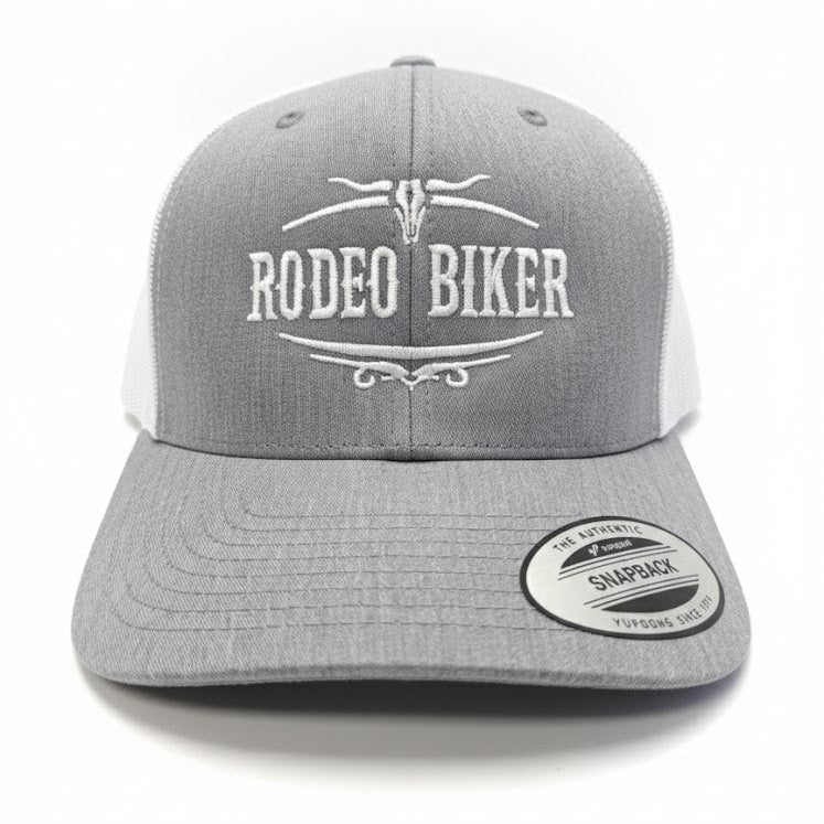 Image of Gray and white cap with 'Rodeo Biker' text on a white background