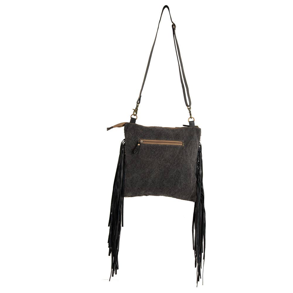 Image of Gray handbag with fringes on a white background