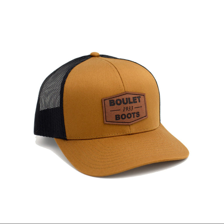 Image of Brown and black trucker cap with 'Boulet Boots' logo on a white background