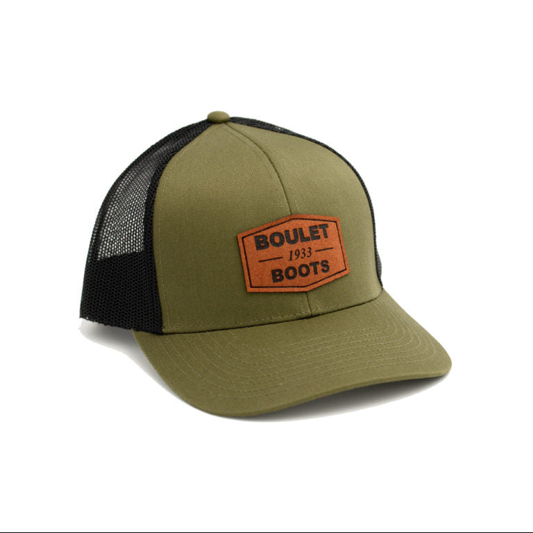 Image of Green and black cap with 'Boulet Boots' logo on a white background