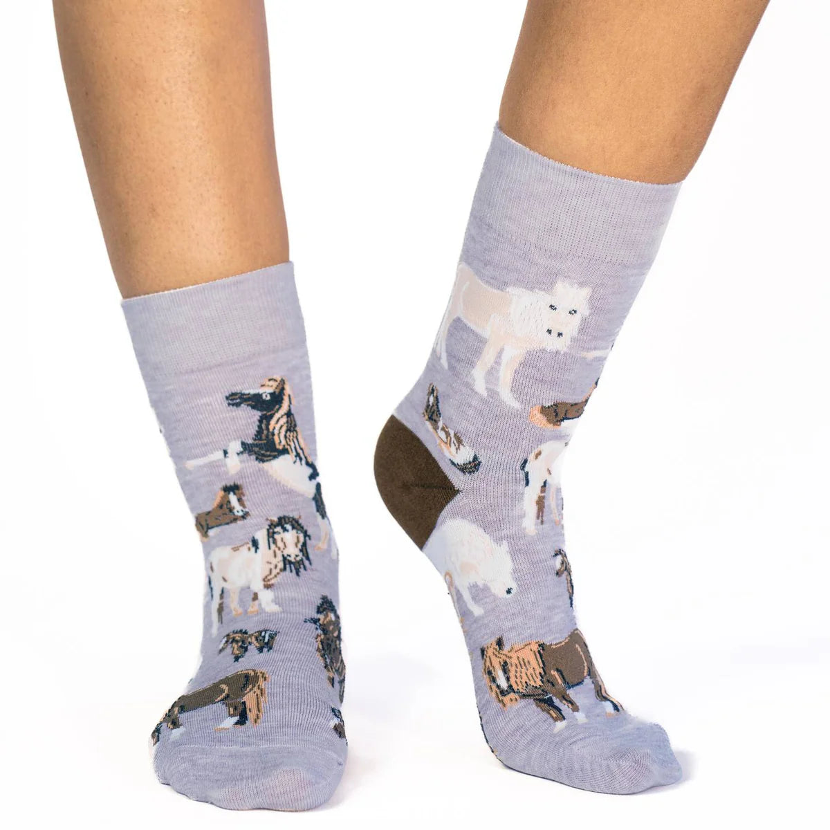 Image of Women’s light heather grey socks with a playful pony pattern, shown worn for a soft equestrian inspired look.