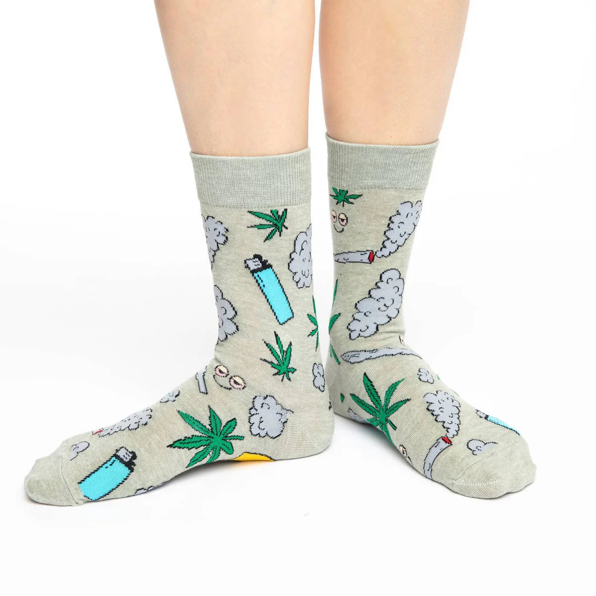 Image of Women’s light grey socks with a playful illustrated leaf and graphic pattern, shown worn for a fun novelty look.