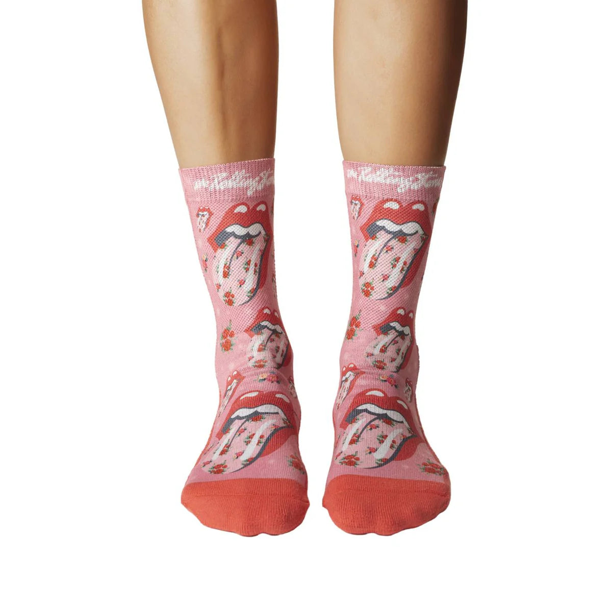 Image of Women’s pink socks with the iconic Rolling Stones tongue logo and floral details, shown worn for a bold rock inspired look.