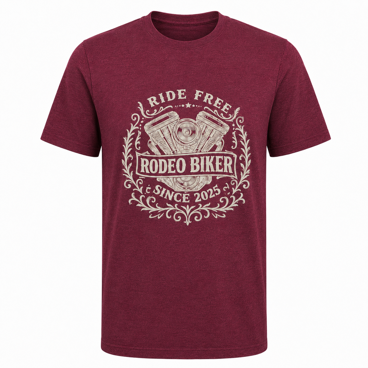 Image of A heathered maroon short-sleeve t-shirt with a distressed cream graphic on the front that reads 'RIDE FREE RODEO BIKER SINCE 2025' with an engine illustration and decorative scrollwork, shown on a plain white background.